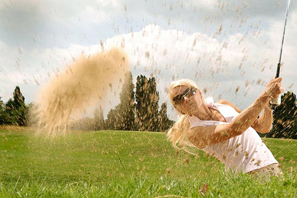 Young person playing golf